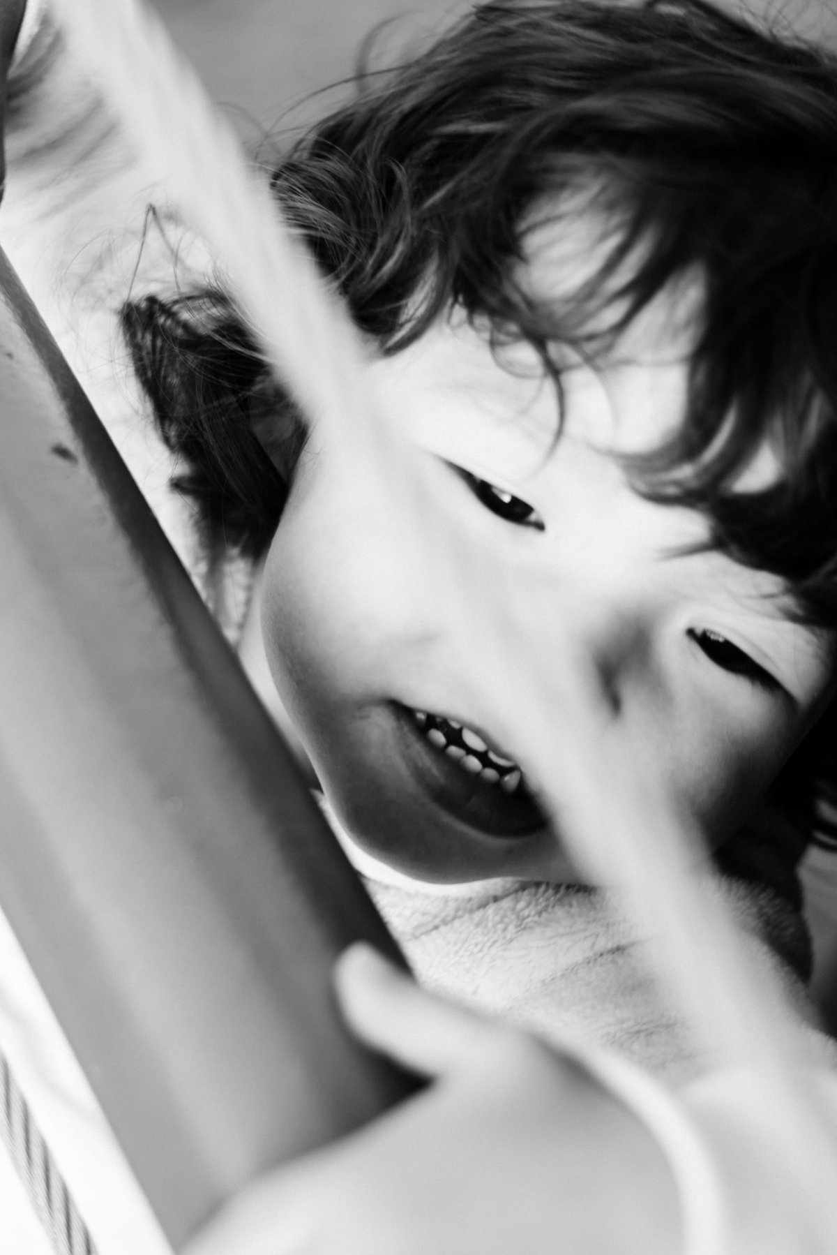 girl looking up between gate