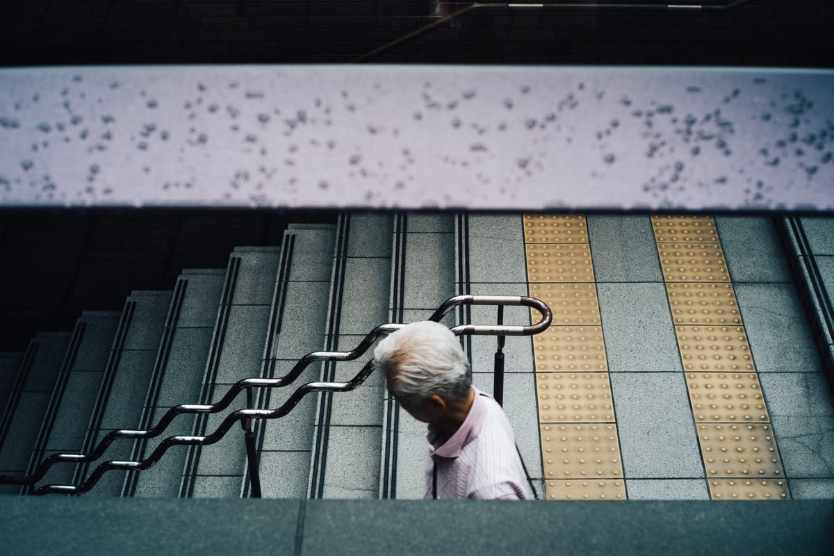 Man walks down stairs