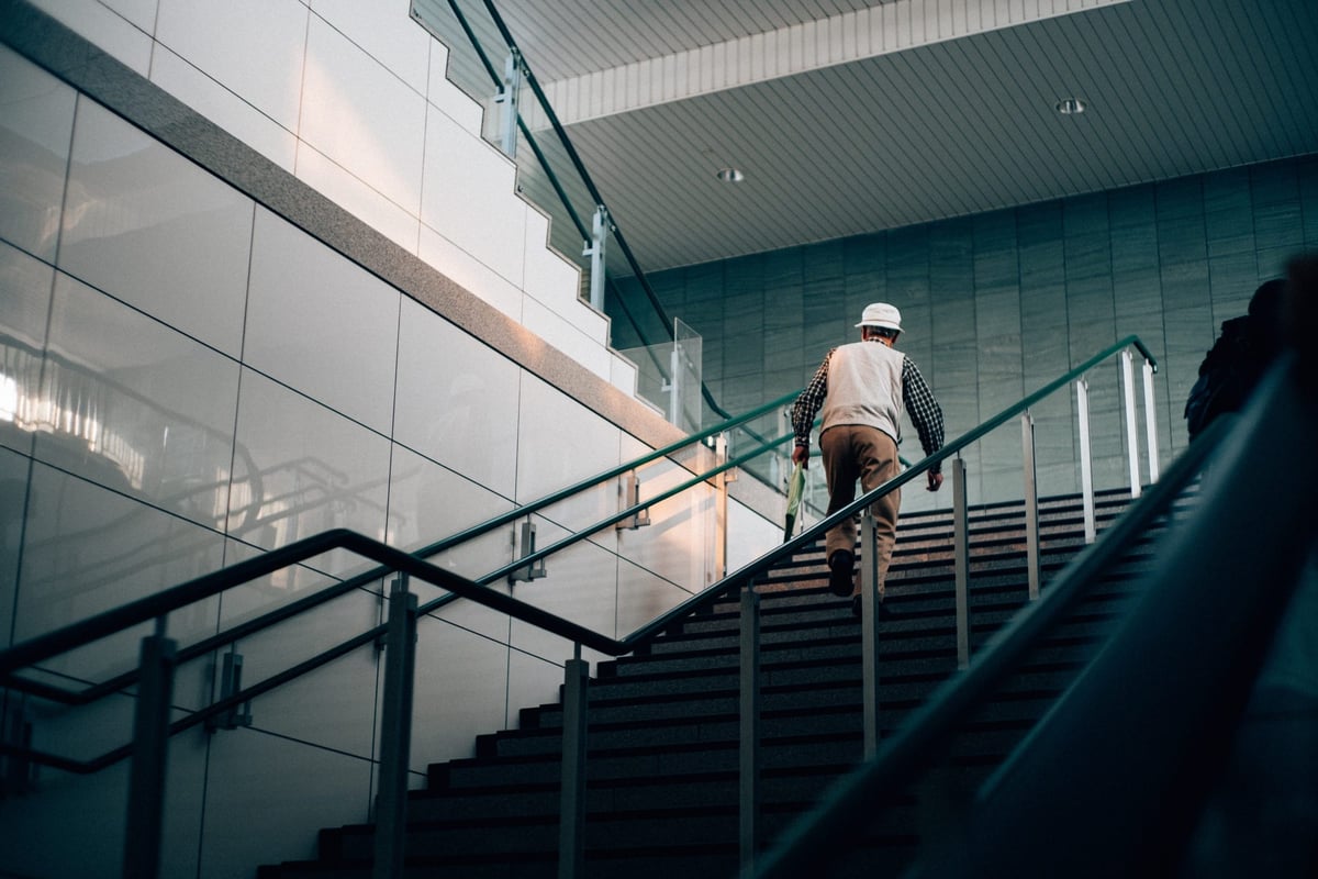 Man walks up stairs