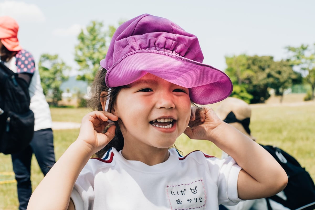 Meike 35mm f1.4 Sample Image of a girl putting on her hat