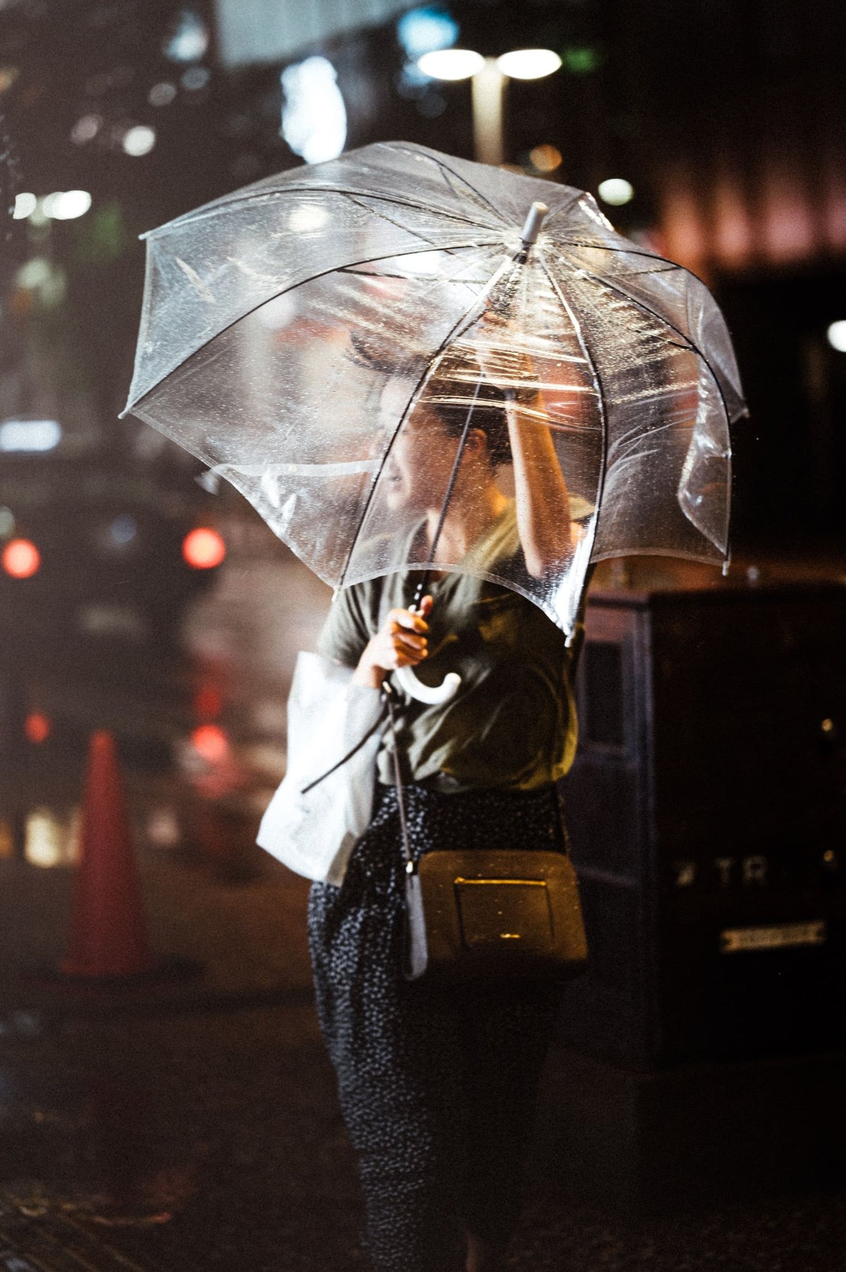 woman holding umbrella in the rain