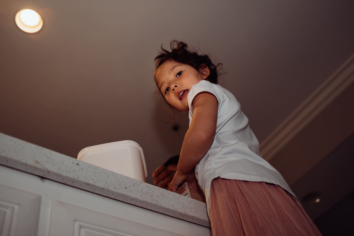 Lifestyle photo sample little girl making cake.