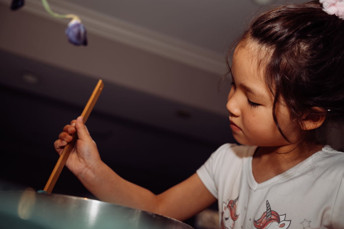 Lifestyle photo sample little girl making cake.