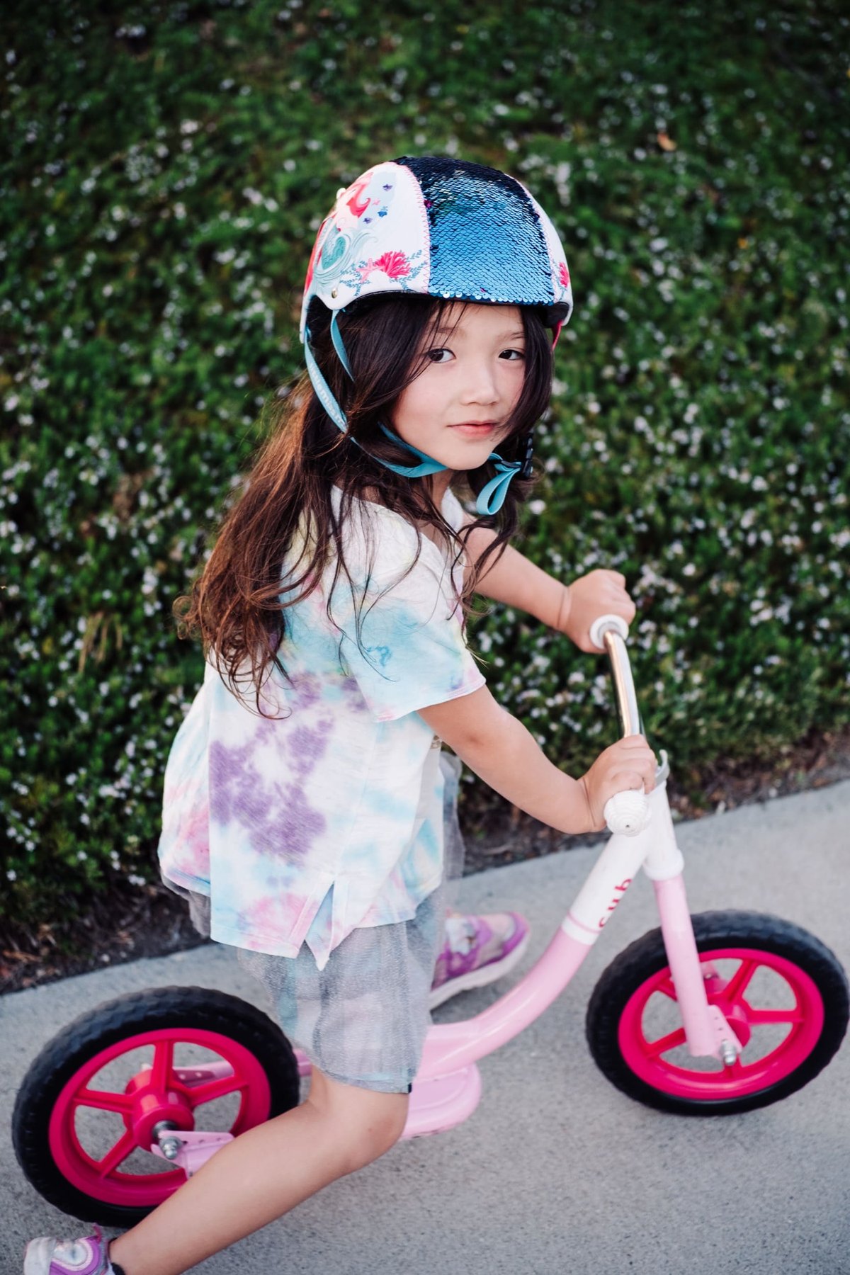 girl rides kick bike.
