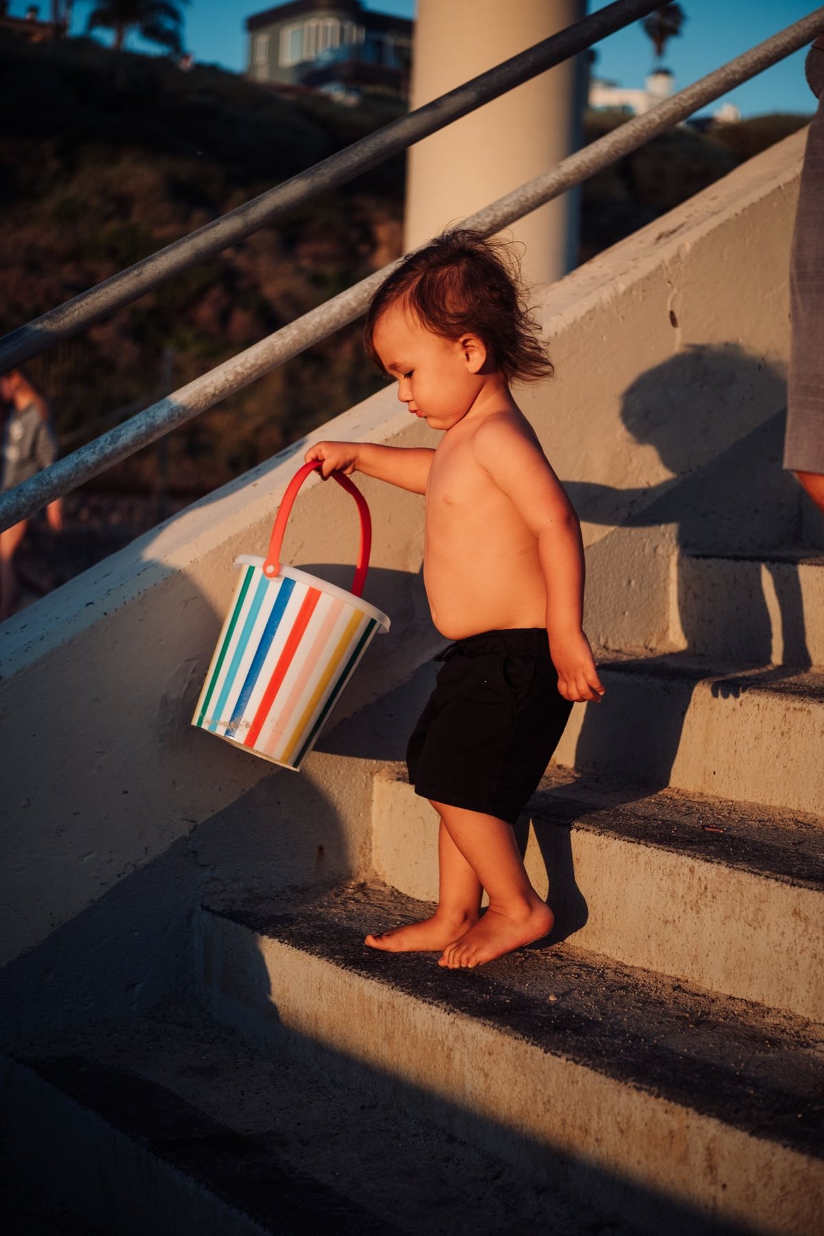 boy walks down stairs.