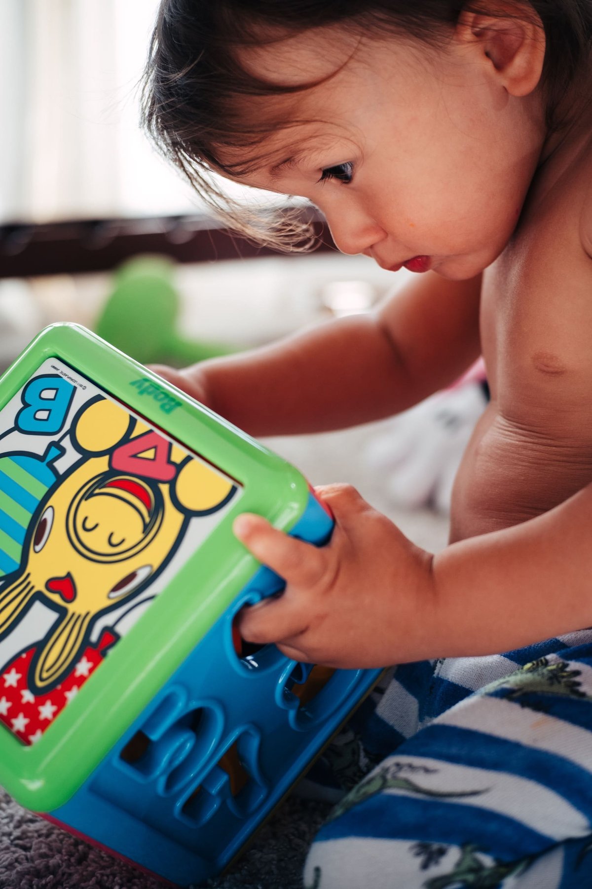 Little boy plays with toys