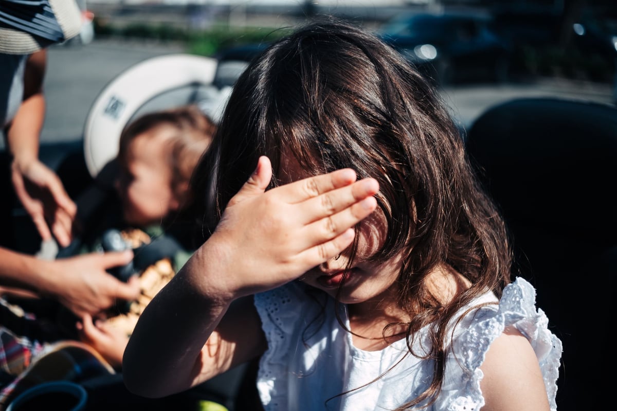 Kalina hides her face in this sample photo