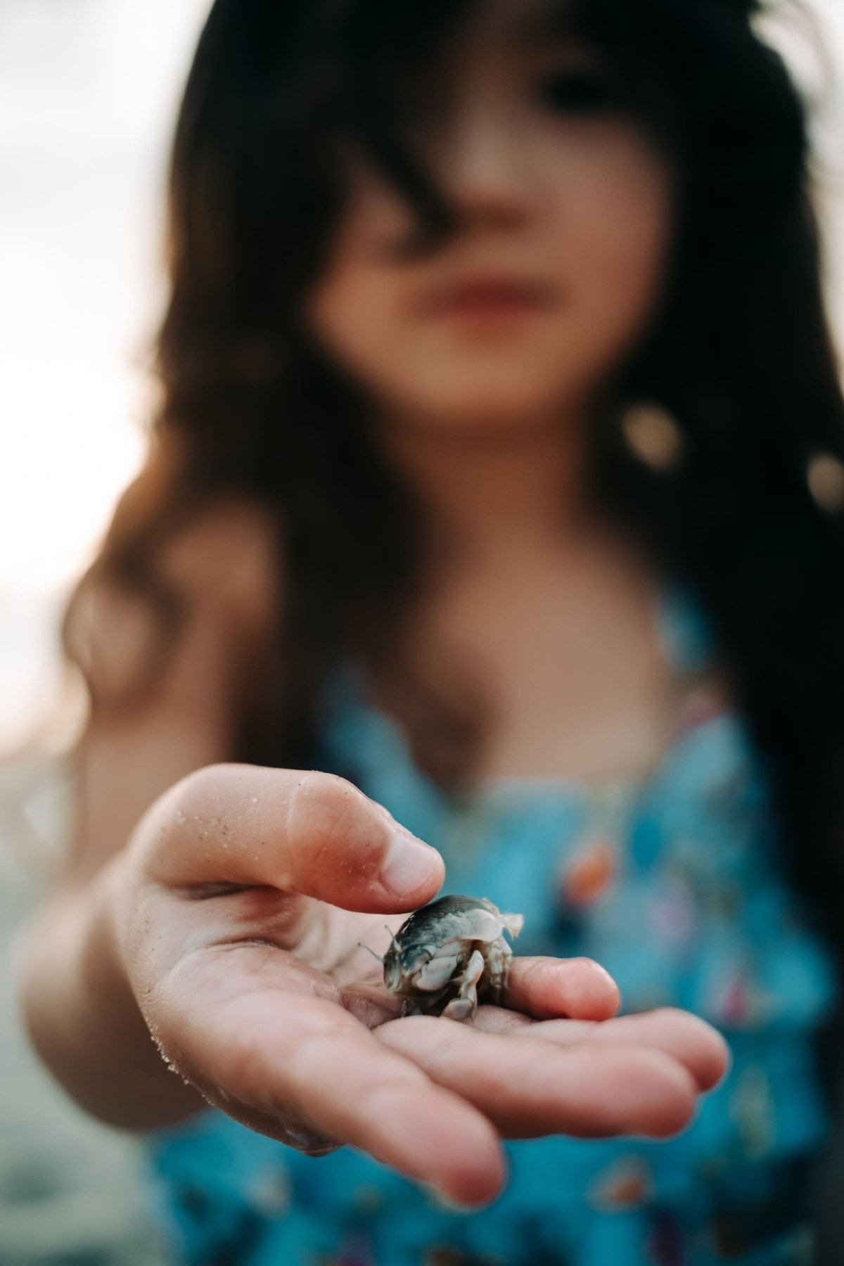 Kalina holds a sand crab.