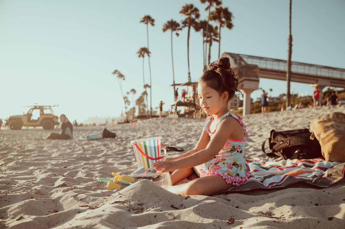 Little Girl Playing In Sand