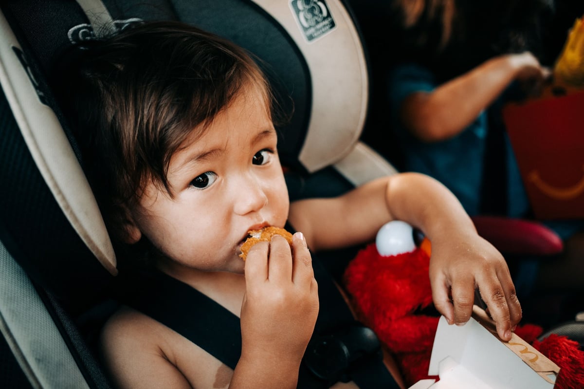 Boy eating nugget