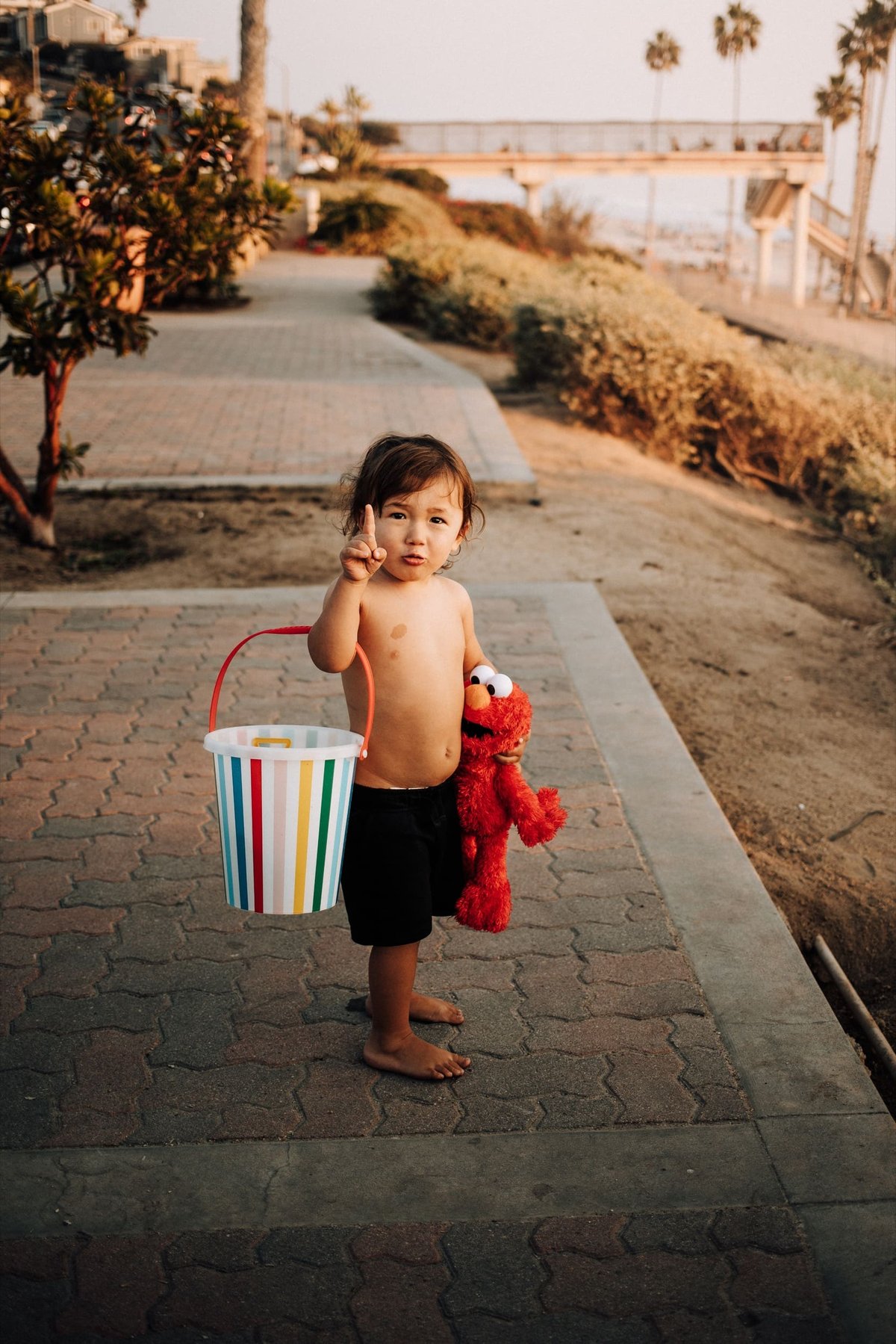 Boy posing with toys