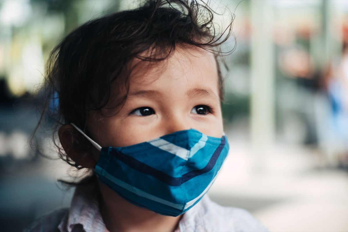 closeup of boy wearing mask.
