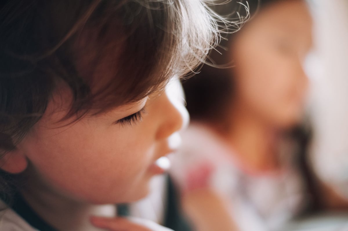 Closeup profile of little boy