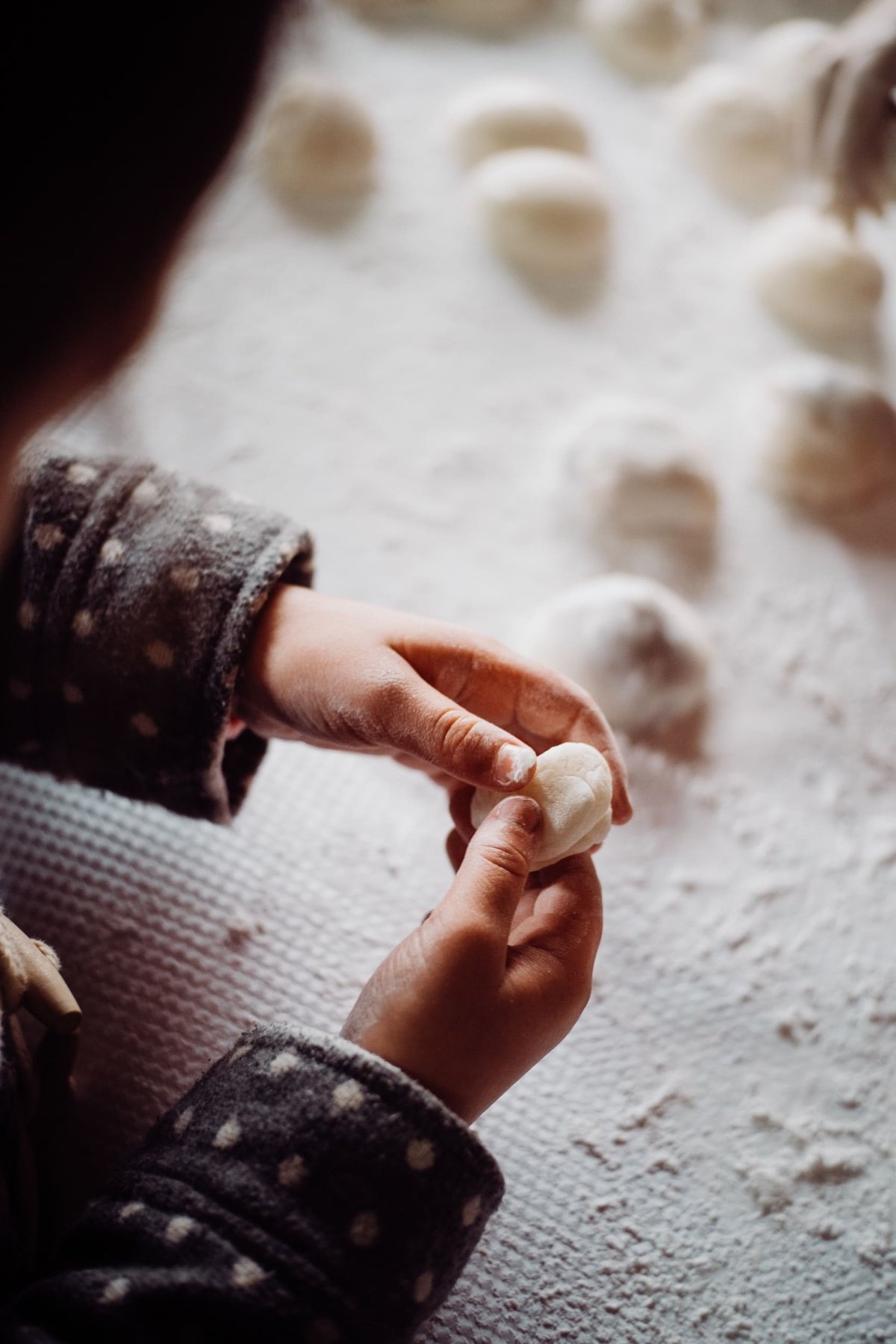 Hands making mochi
