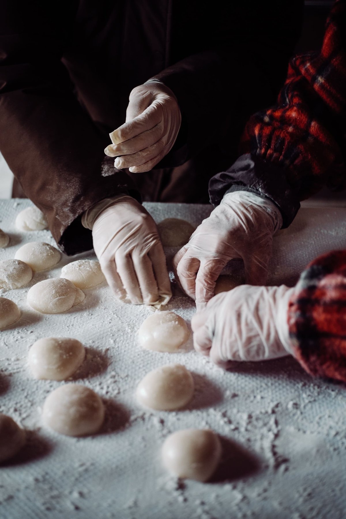 Hand on table making Mochi