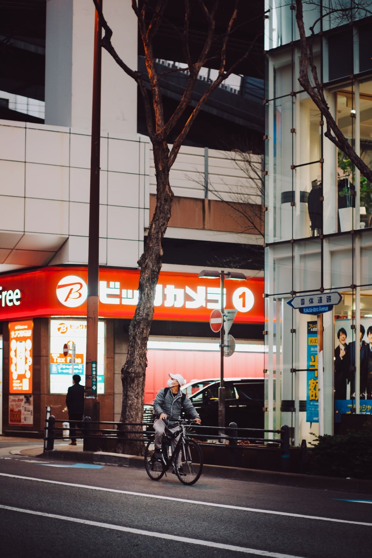 TTArtisan 50mm f1.2 Photo sample of a biker in front of the Bic store in Tenjin.