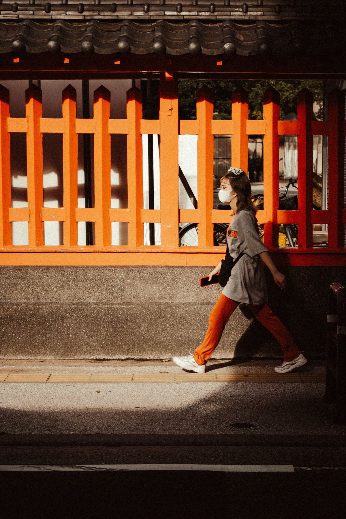 Japan street photos woman steps out of shadow