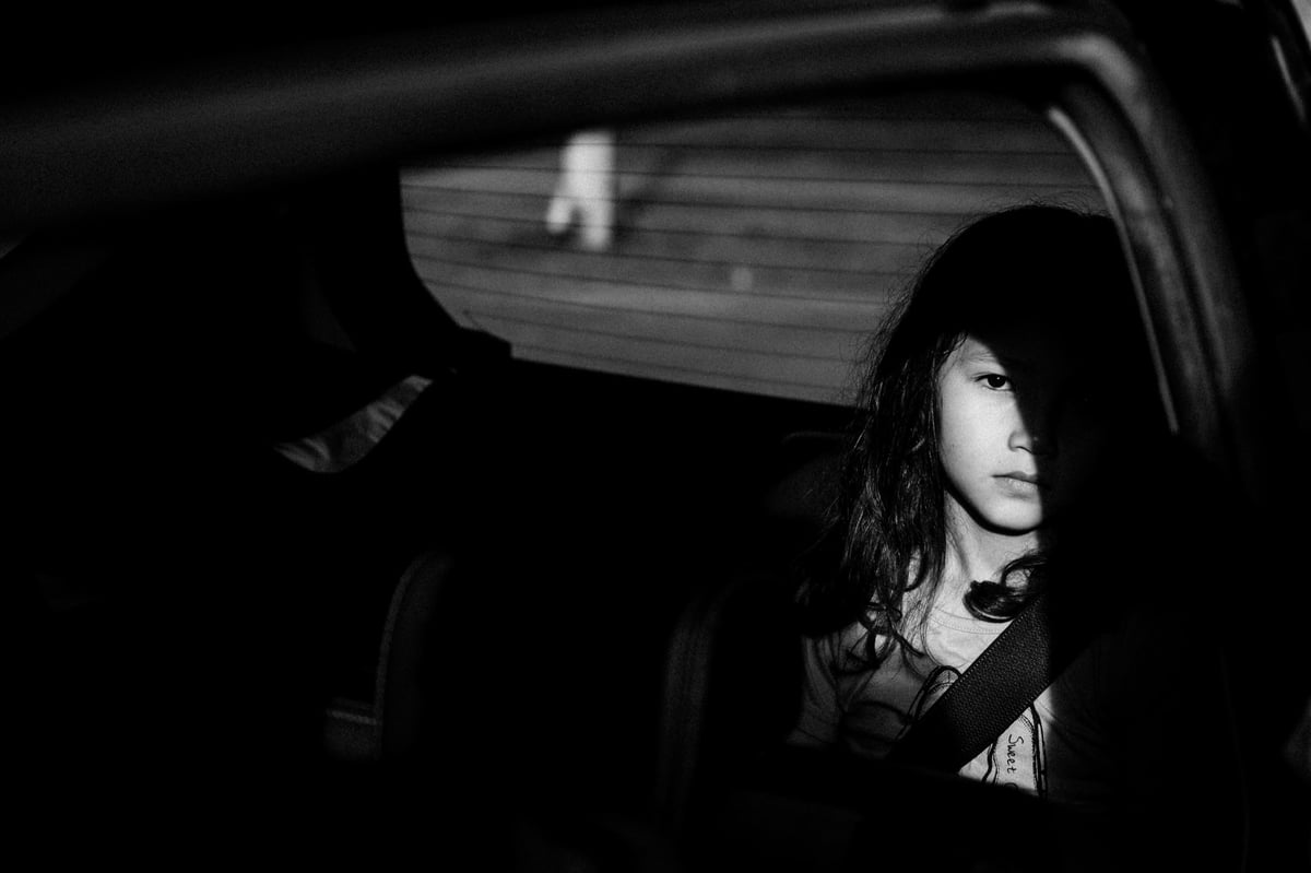 Girl in the shadows.