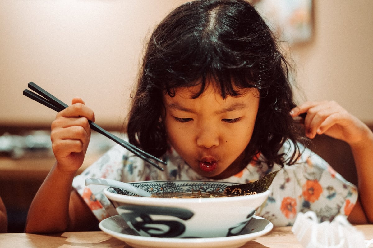 girl slurps up ramen