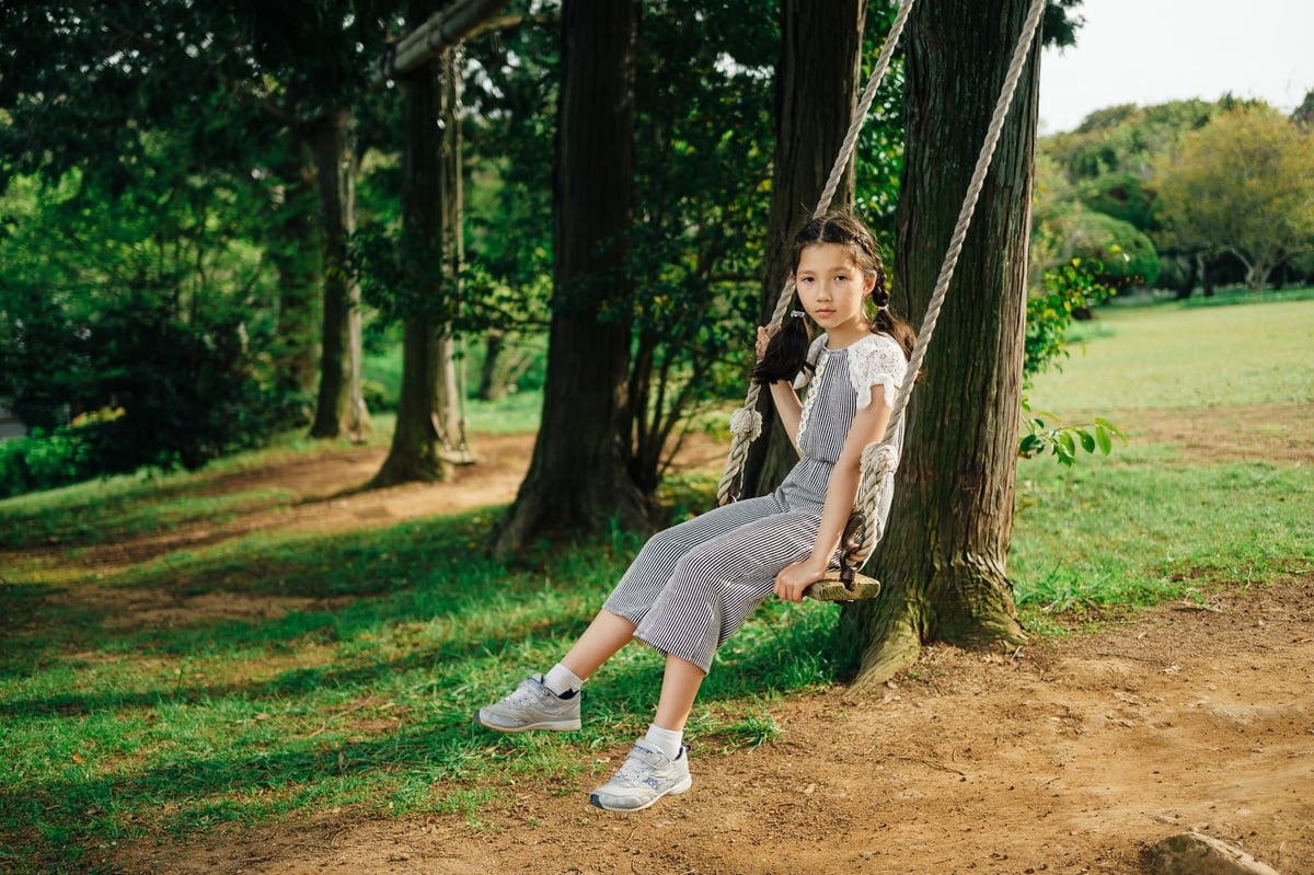 Kalina sitting on swing with glimmerglass 1/4 diffusion filter