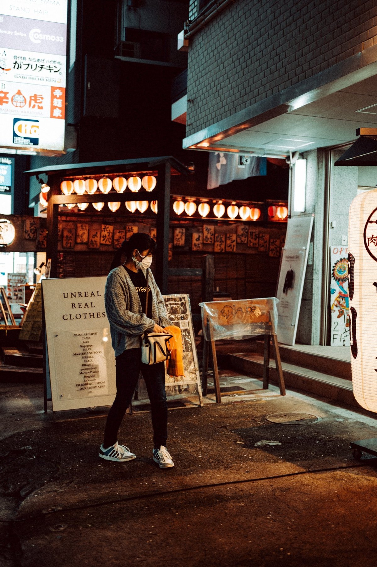 Man reaching into his man purse.