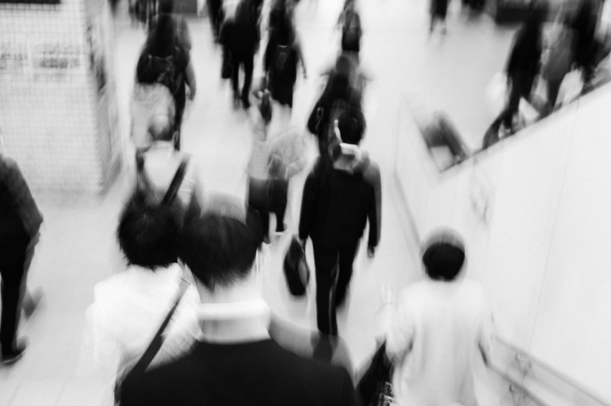 Slow Shutter black and white shot of crowd from above.
