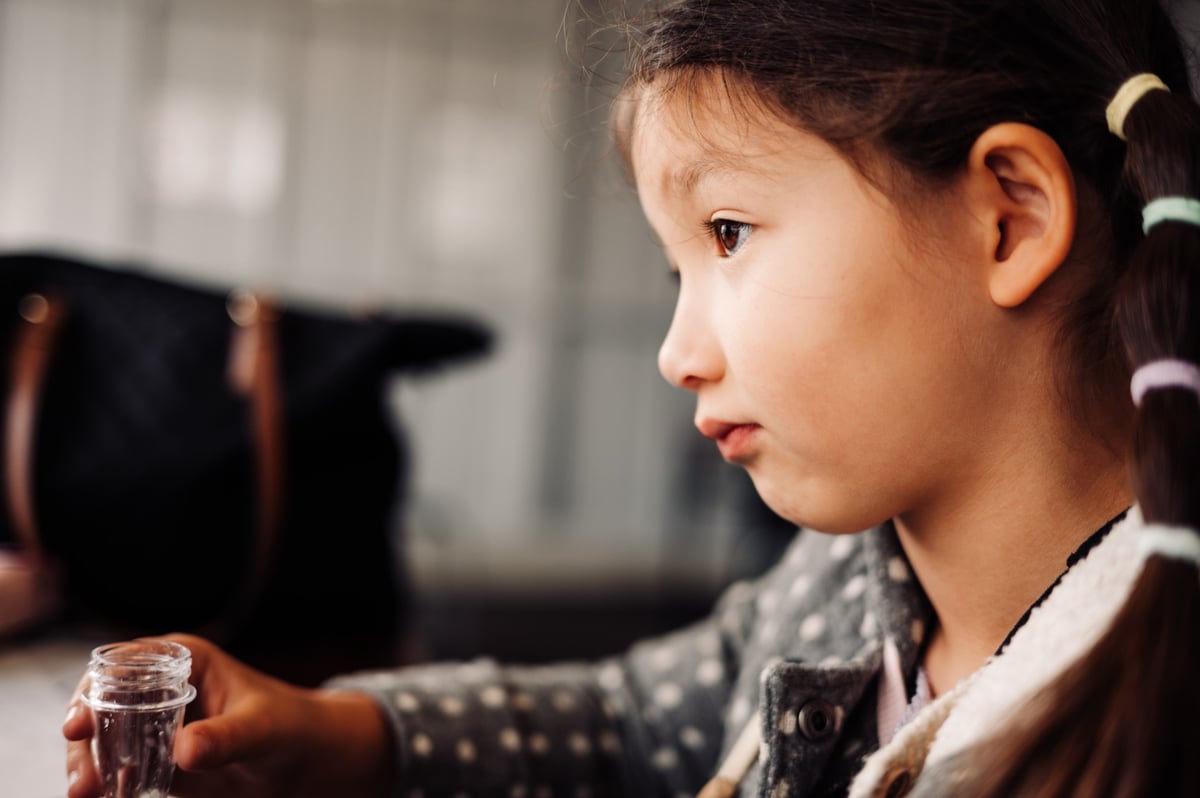 Little girl staring off into the distance.