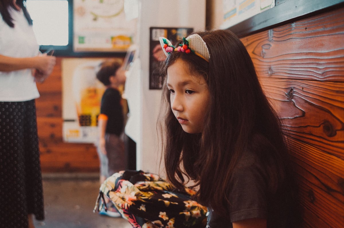 Lifestyle photo of girl with cat ears
