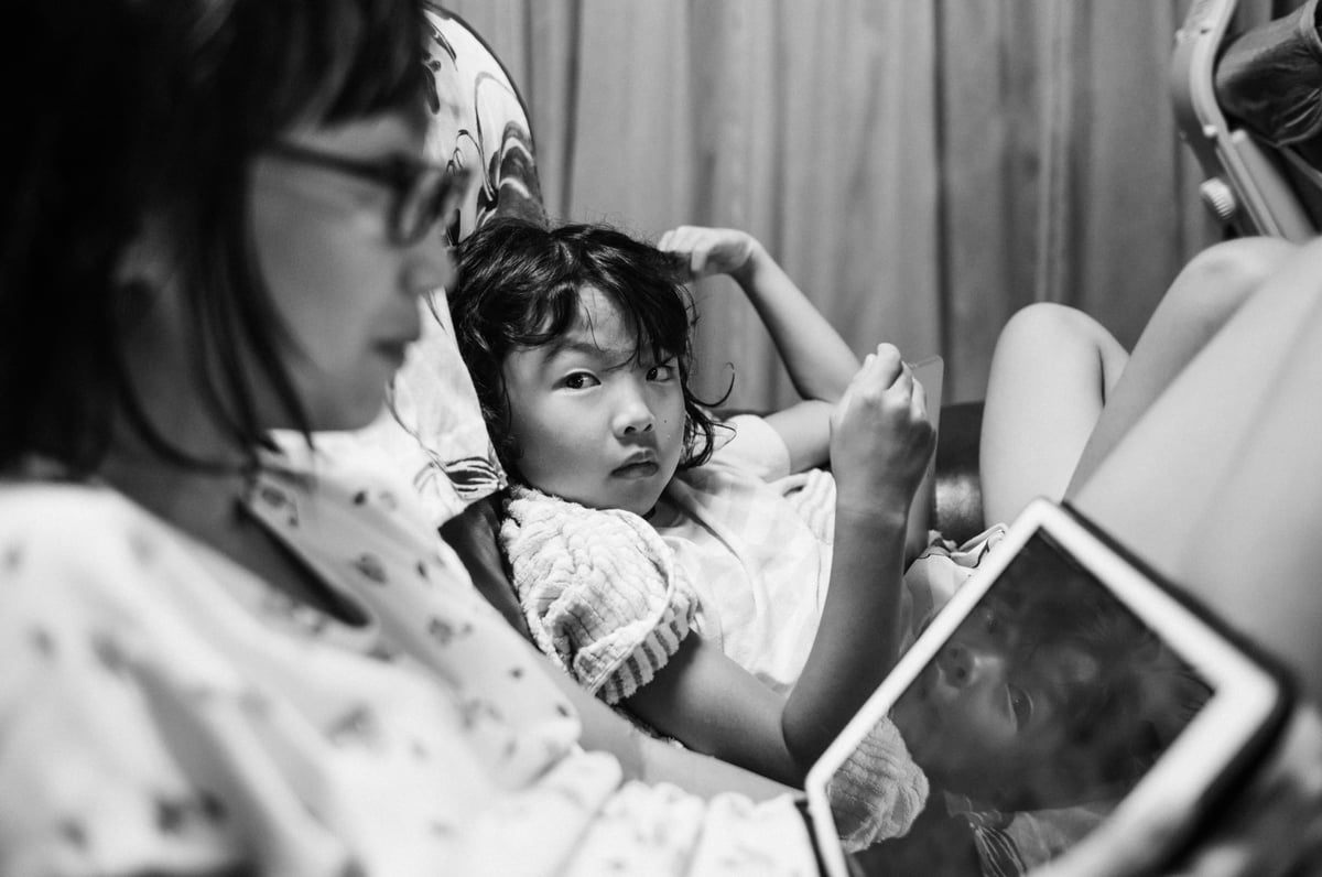 Black and white candid photo of Japanese girls hanging out.
