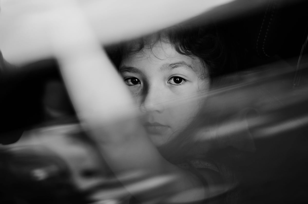portrait of little girl in black and white