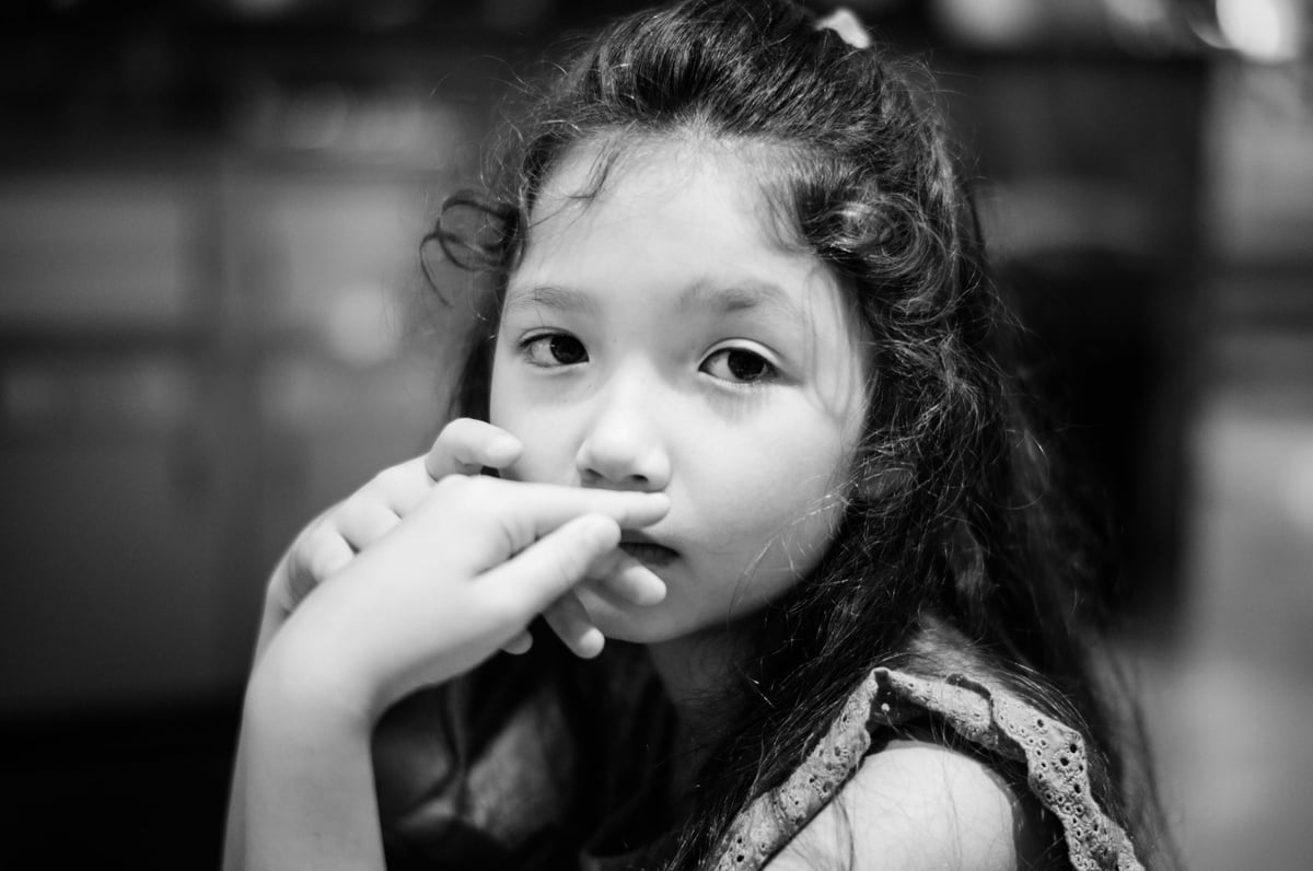 portrait of little girl in black and white