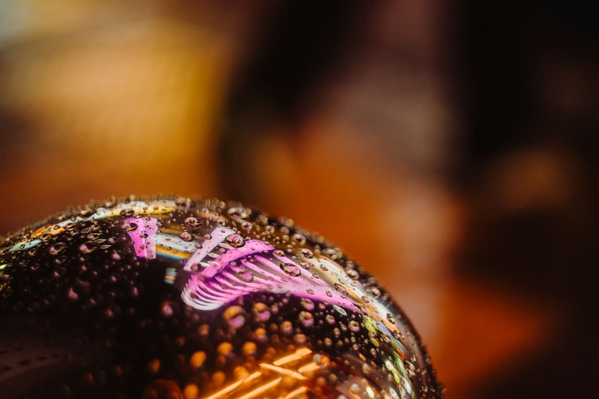 Water Droplets reflecting on a chrome surface.