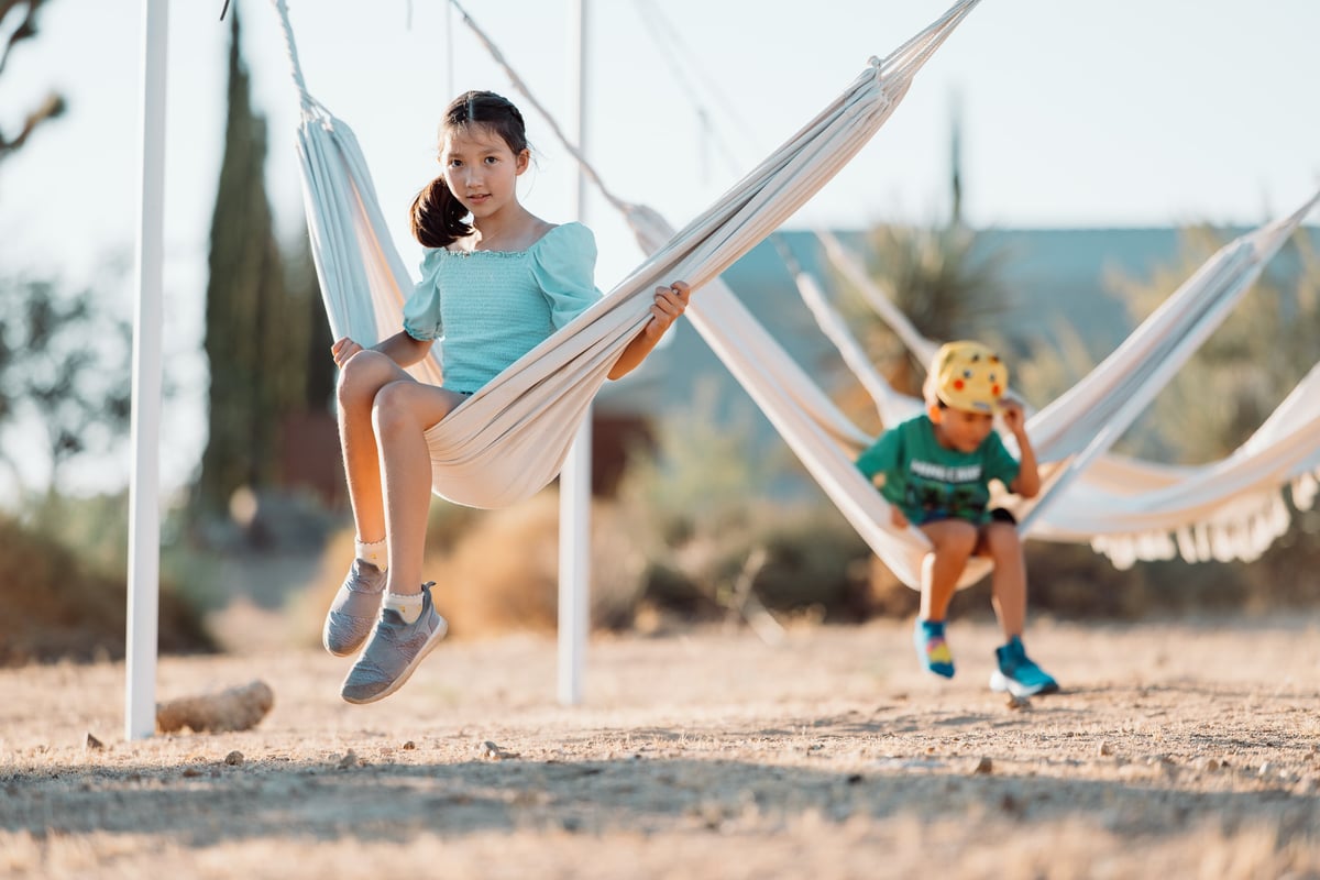 kids playing on hammocks